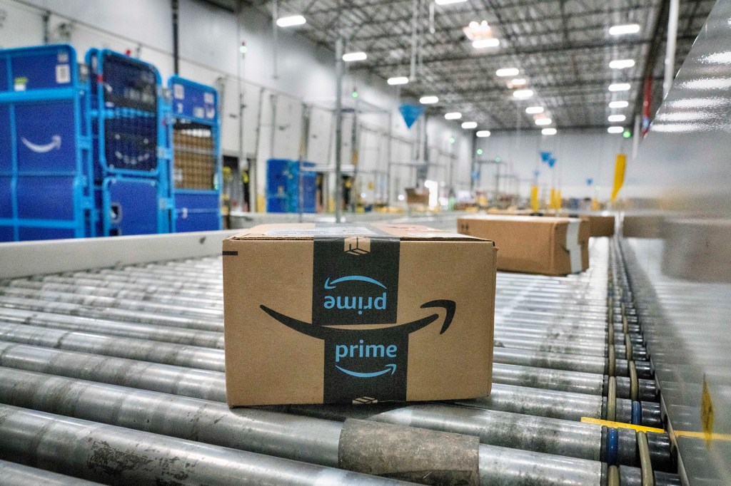 A package moves along a conveyor belt at Amazon's DAX7 delivery station during the annual Prime Day event